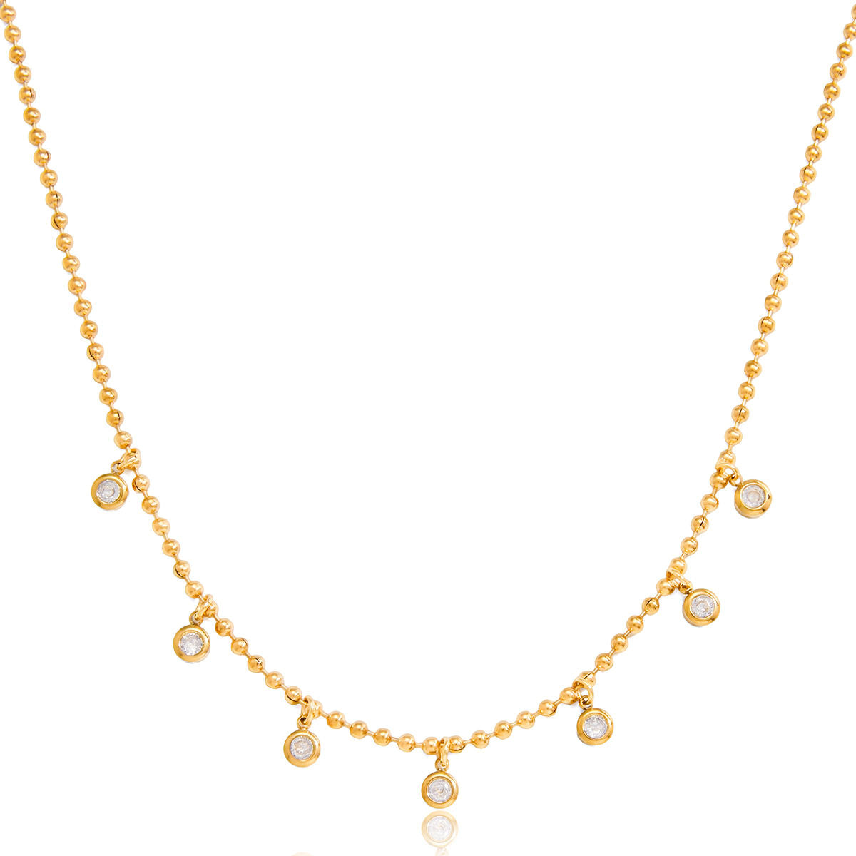 Gold necklace with small round pendants on a white background