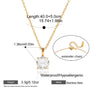 Gold necklace with a heart-shaped pendant, extender chain, and measurement details on a white background.