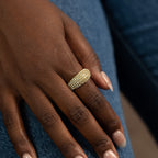 Gold ring on a hand with a blurred background
