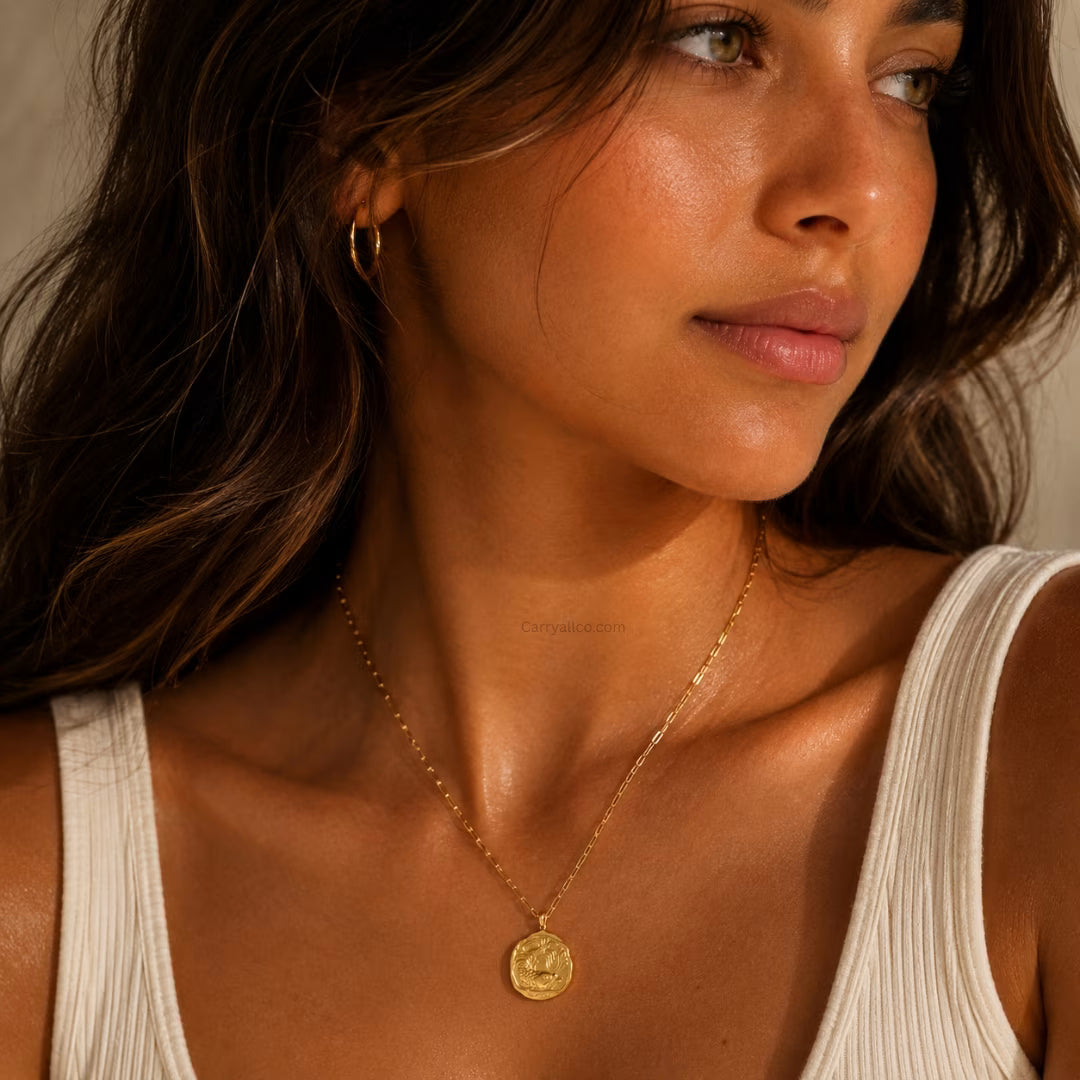 Woman wearing a gold necklace with a coin pendant, close-up shot.