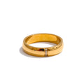 Gold ring with a diamond on a white background