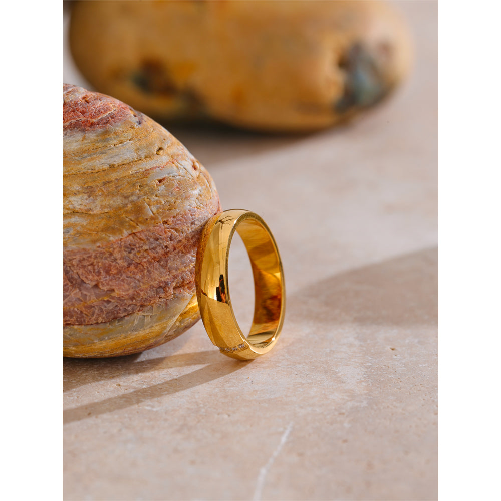 Gold ring on a stone surface