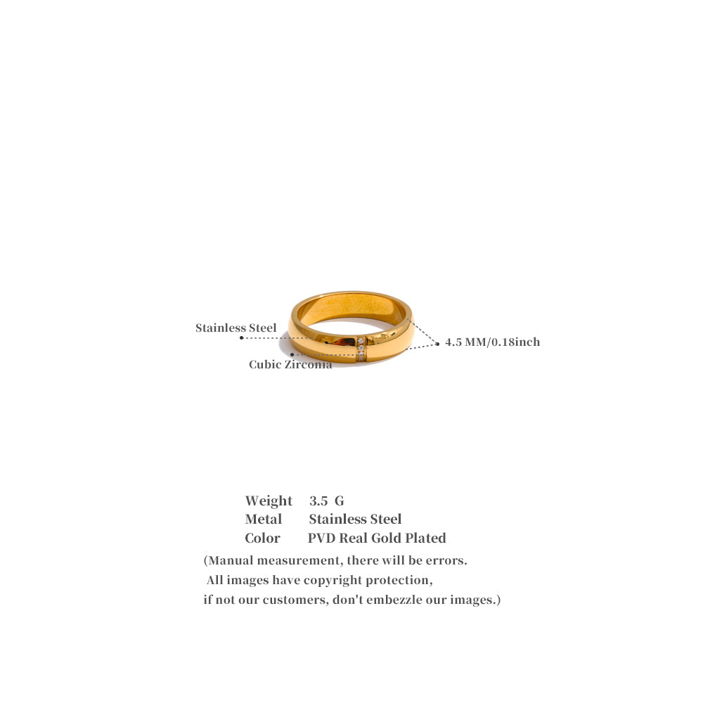 Gold ring with cubic zirconia on a white background