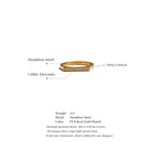 Gold ring with cubic zirconia stones on a white background