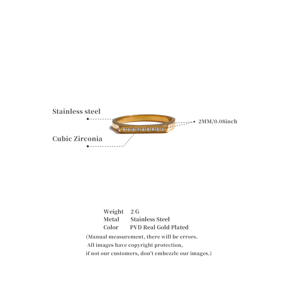 Gold ring with cubic zirconia stones on a white background