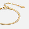 Gold bracelet on a white background