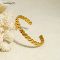 Gold braided bracelet on a beige background with 'CARRYALICO' branding.