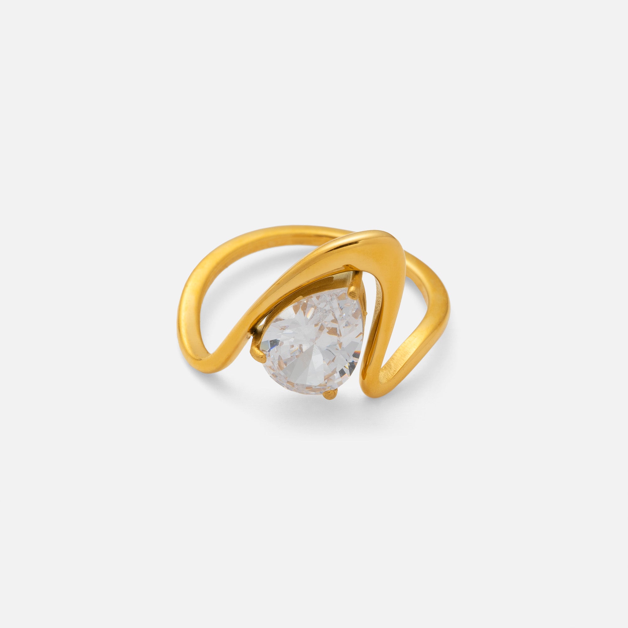 Gold ring with a clear gemstone on a white background