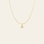 A delicate gold chain necklace featuring a small pendant shaped like the letter 'A', embellished with small clear stones, shown against a plain white background.