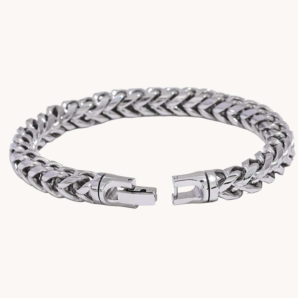 Silver chain bracelet with a clasp on a white background