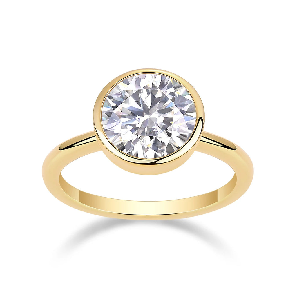 Gold ring with a large diamond on a white background